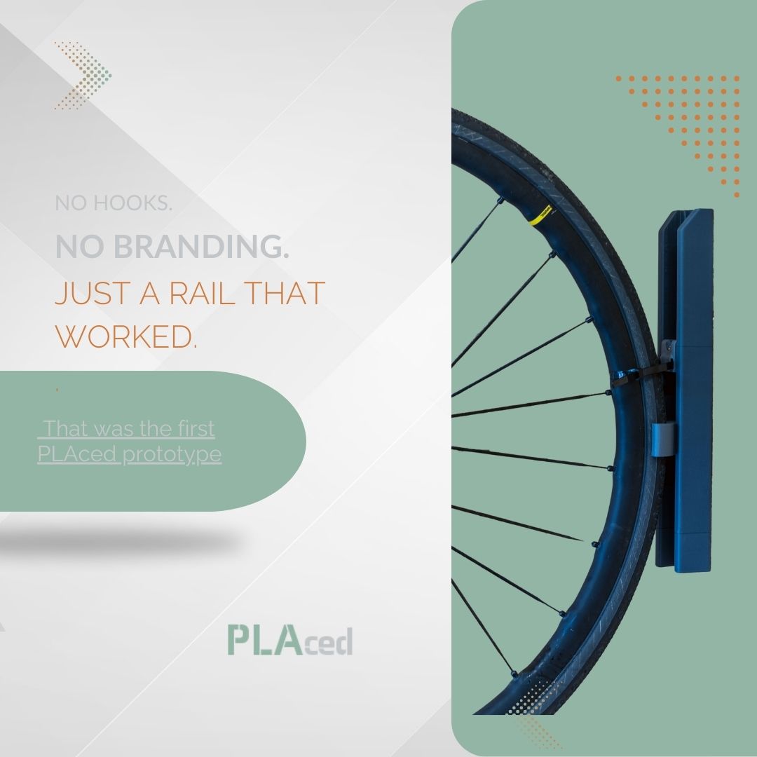 The First PLAced Prototype – Just a Rail First PLAced prototype showing a bike wheel on the original unbranded wall rail with HO hook and cable tie, used for winter storage.