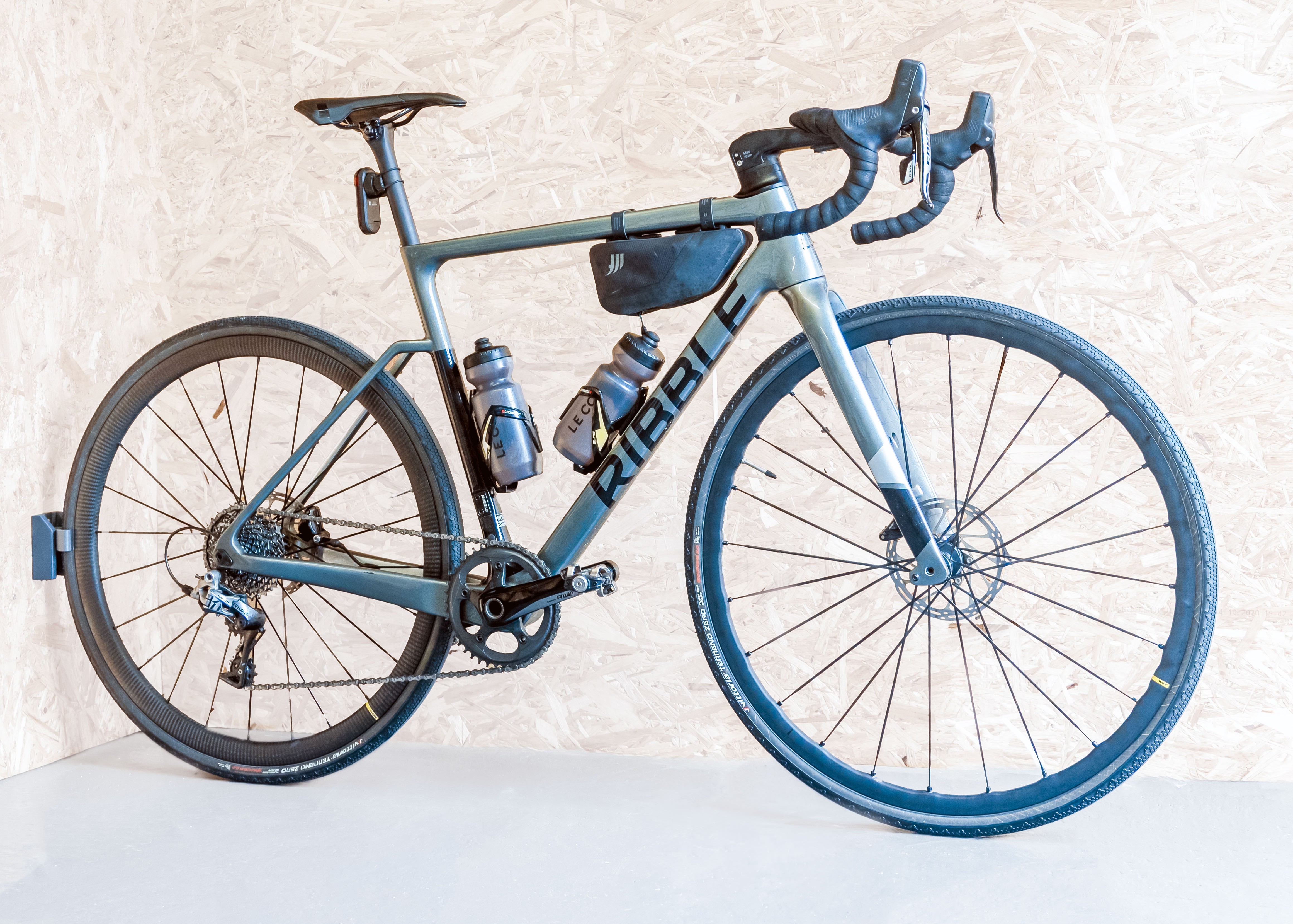 Ride Ready Bike Stand By PLAced Image of a bike stored horizontally for ride prep using the bottom rail of the verticale bike storage system